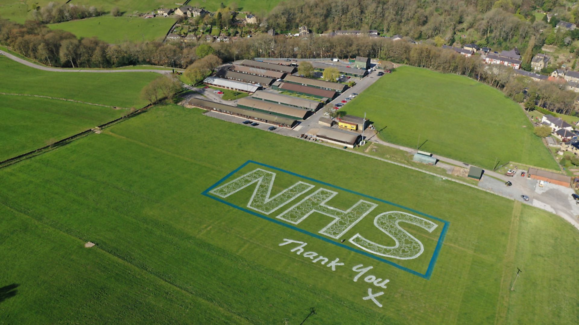 A field art piece celebrating the NHS created by Jamie Wardley of Sand In Your Eye in Mytholmroyd, West Yorkshire. Photograph: Sand In Your Eye/PA Wire

. - Credit: PA