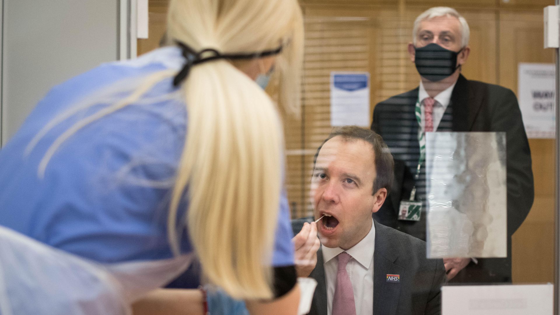 Health Secretary Matt Hancock takes a coronavirus test at a new Covid-19 testing facility in the Houses of Parliament in London watched by the Speaker of the House of Commons, Sir Lindsay Hoyle - Credit: PA