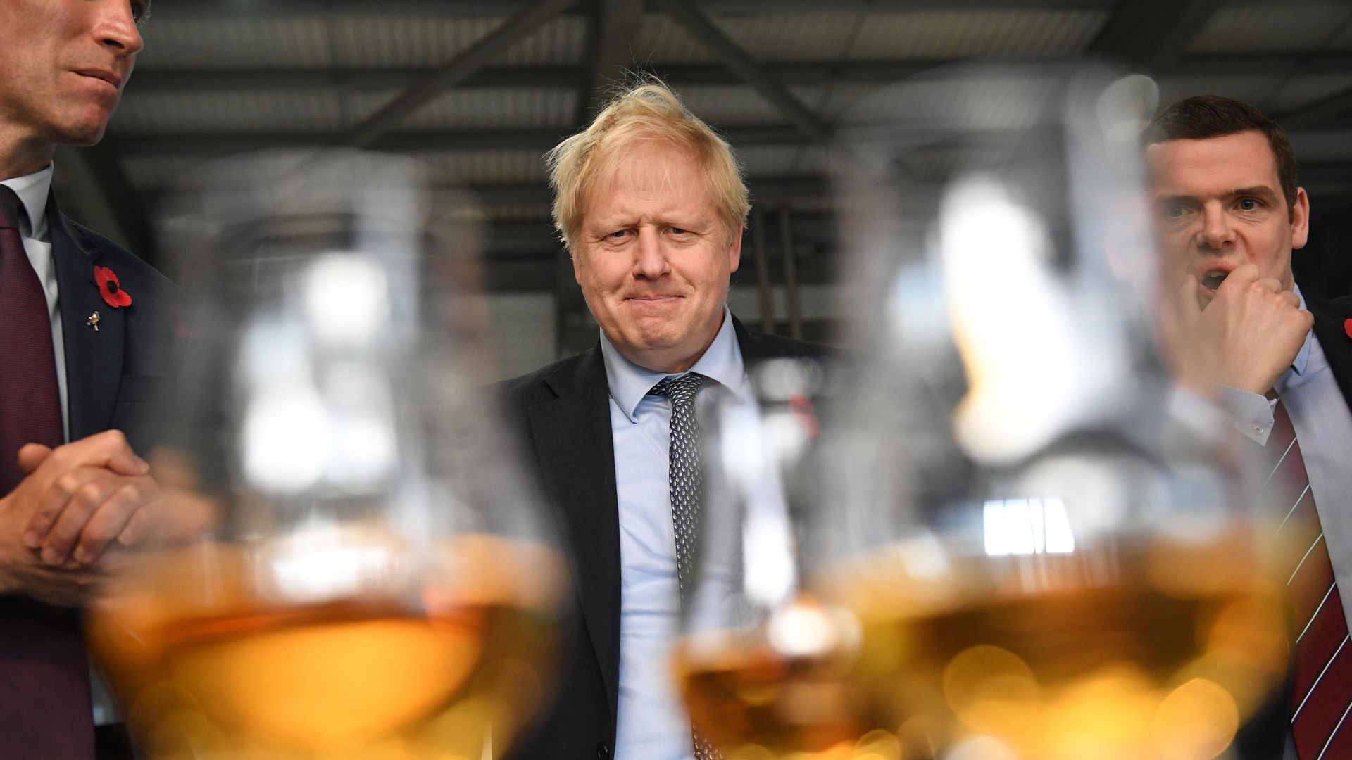 Prime minister Boris Johnson tastes whisky at the Roseisle Distillery in Scotland near Moray with Ewan Andrew (left) from Diagio and Douglas Ross MP (right), at the start of the General Election campaign in 2019 - Credit: PA