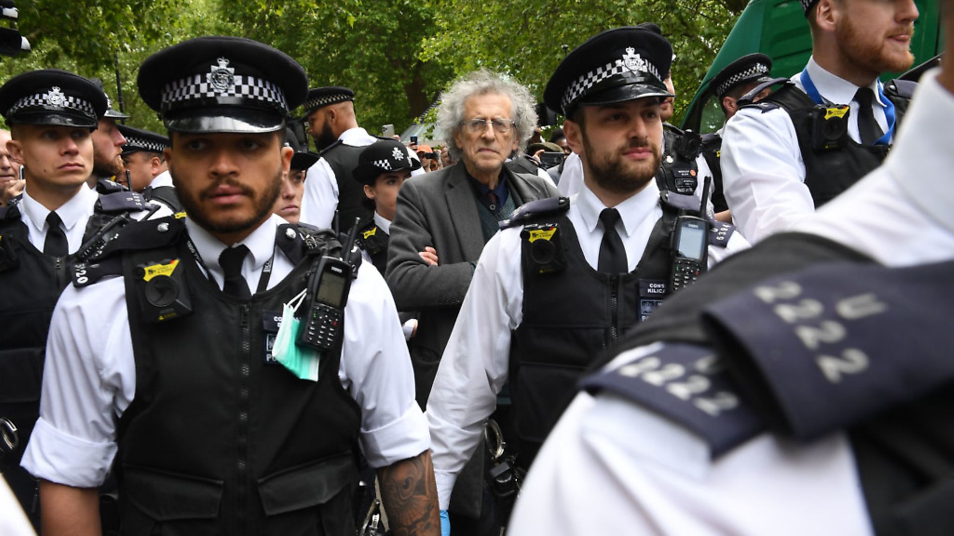 Police lead away Piers Corbyn, brother of former Labour leader Jeremy Corbyn, as protesters gather in breach of lockdown rules in Hyde Park in London after the introduction of measures to bring the country out of lockdown. Photograph: Stefan Rousseau/PA Wire. - Credit: PA