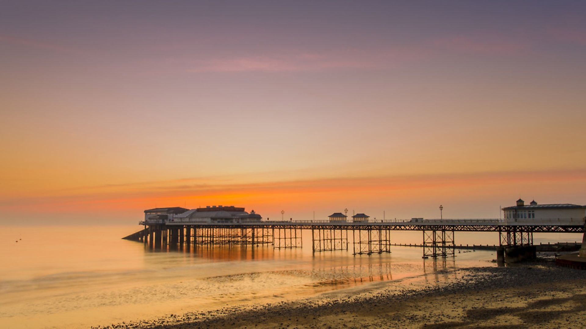 Timeless: Cromer pier at sunrise. (Photo by: Loop Images/Universal Images Group via Getty Images) - Credit: Universal Images Group via Getty