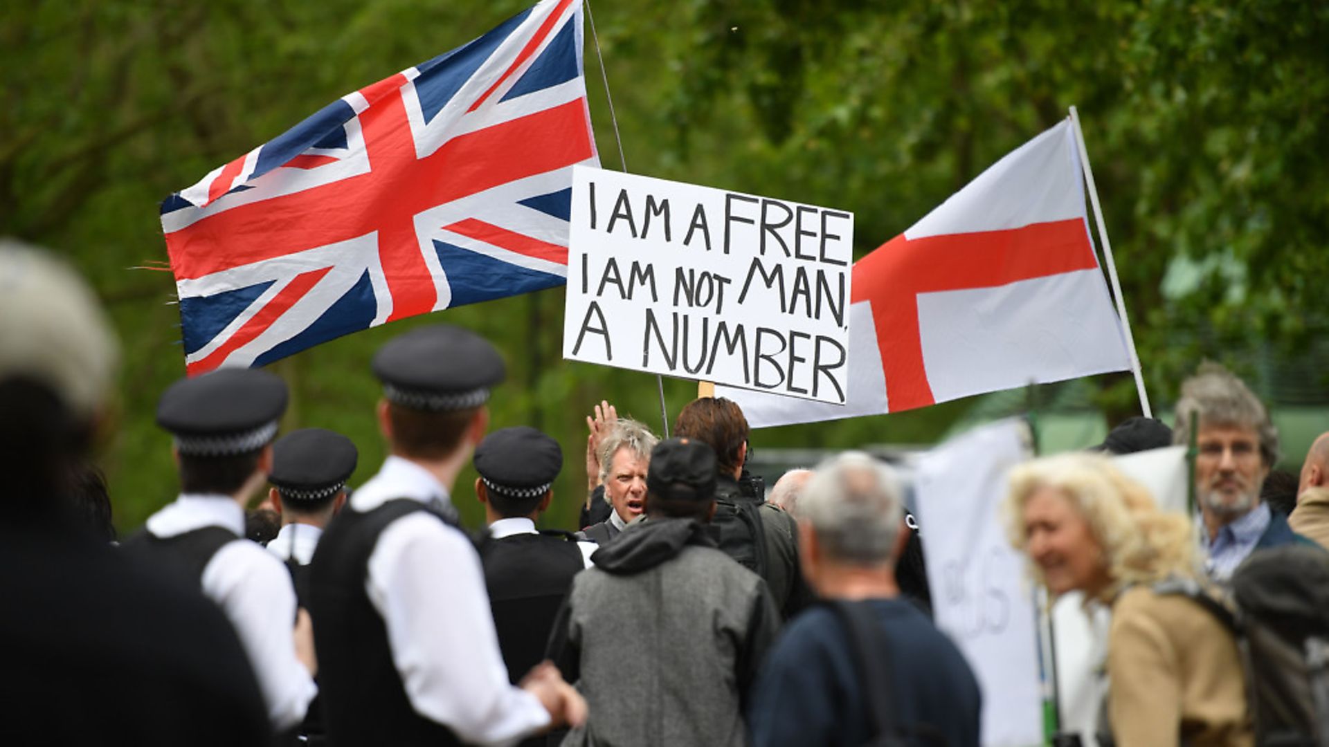Police attend an anti-coronavirus lockdown demonstration with protesters in London's Hyde Park. Picture: Getty Images - Credit: AFP via Getty Images