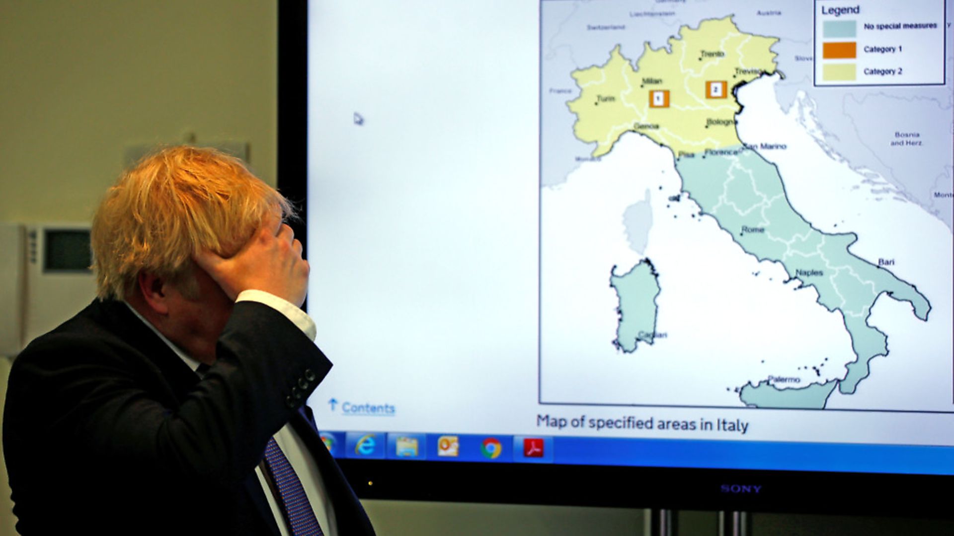Britain's Prime Minister Boris Johnson gestures in front of a map of Italy during a visit to the Public Health England National Infection Service in Colindale in north London. (Photo by HENRY NICHOLLS / POOL / AFP) (Photo by HENRY NICHOLLS/POOL/AFP via Getty Images) - Credit: POOL/AFP via Getty Images