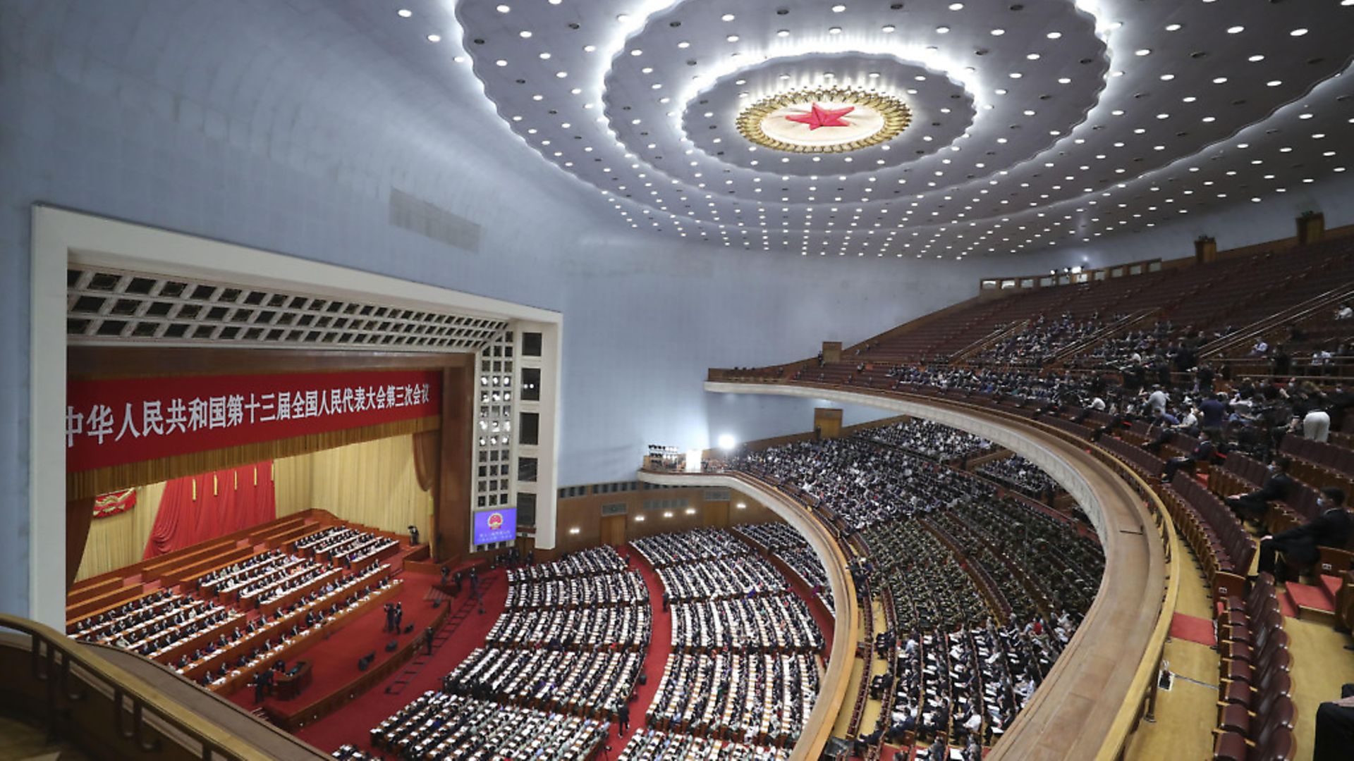 BEIJING, CHINA - MAY 22: Delegates attend the opening meeting of the third session of the 13th National People's Congress (NPC) at the Great Hall of the People on May 22, 2020 in Beijing, China. (Photo by Du Yang/China News Service via Getty Images) - Credit: China News Service via Getty Ima