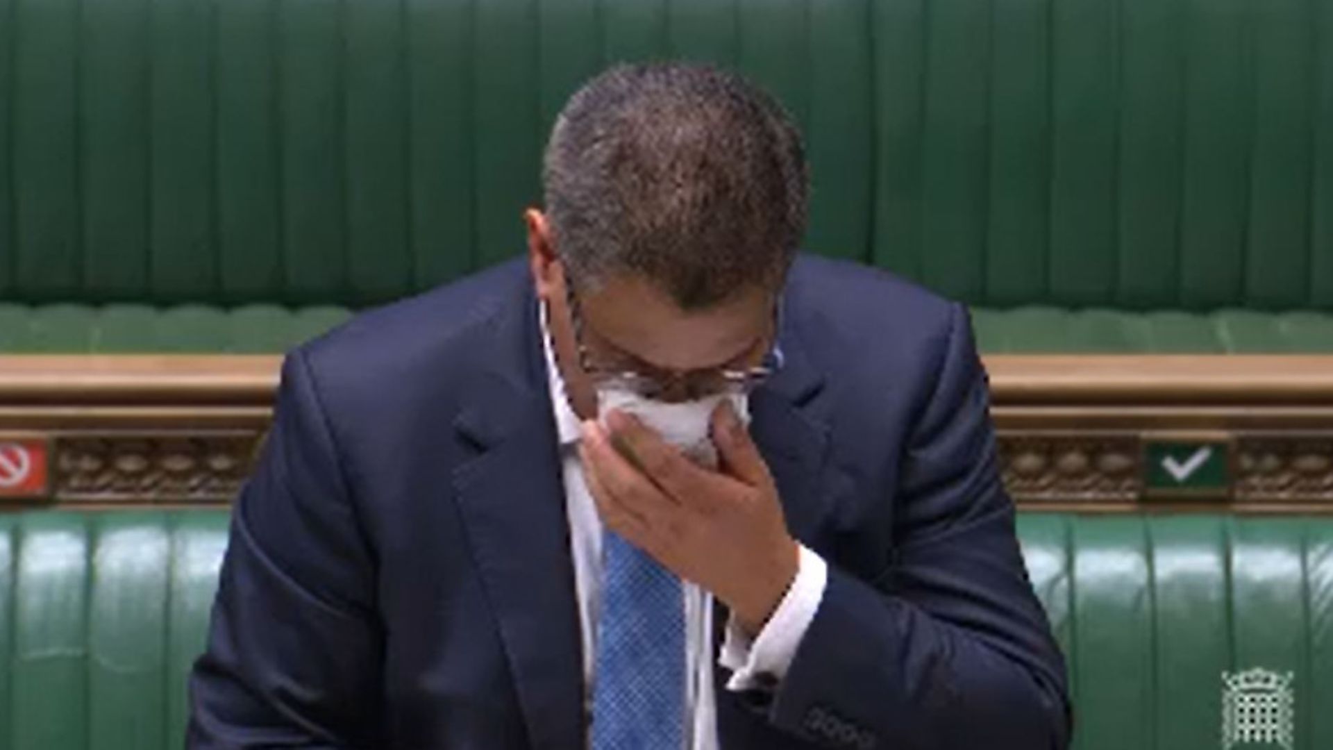 Business secretary Alok Sharma wipes his face during a speech in the House of Commons. Photograph: PA Wire. - Credit: PA