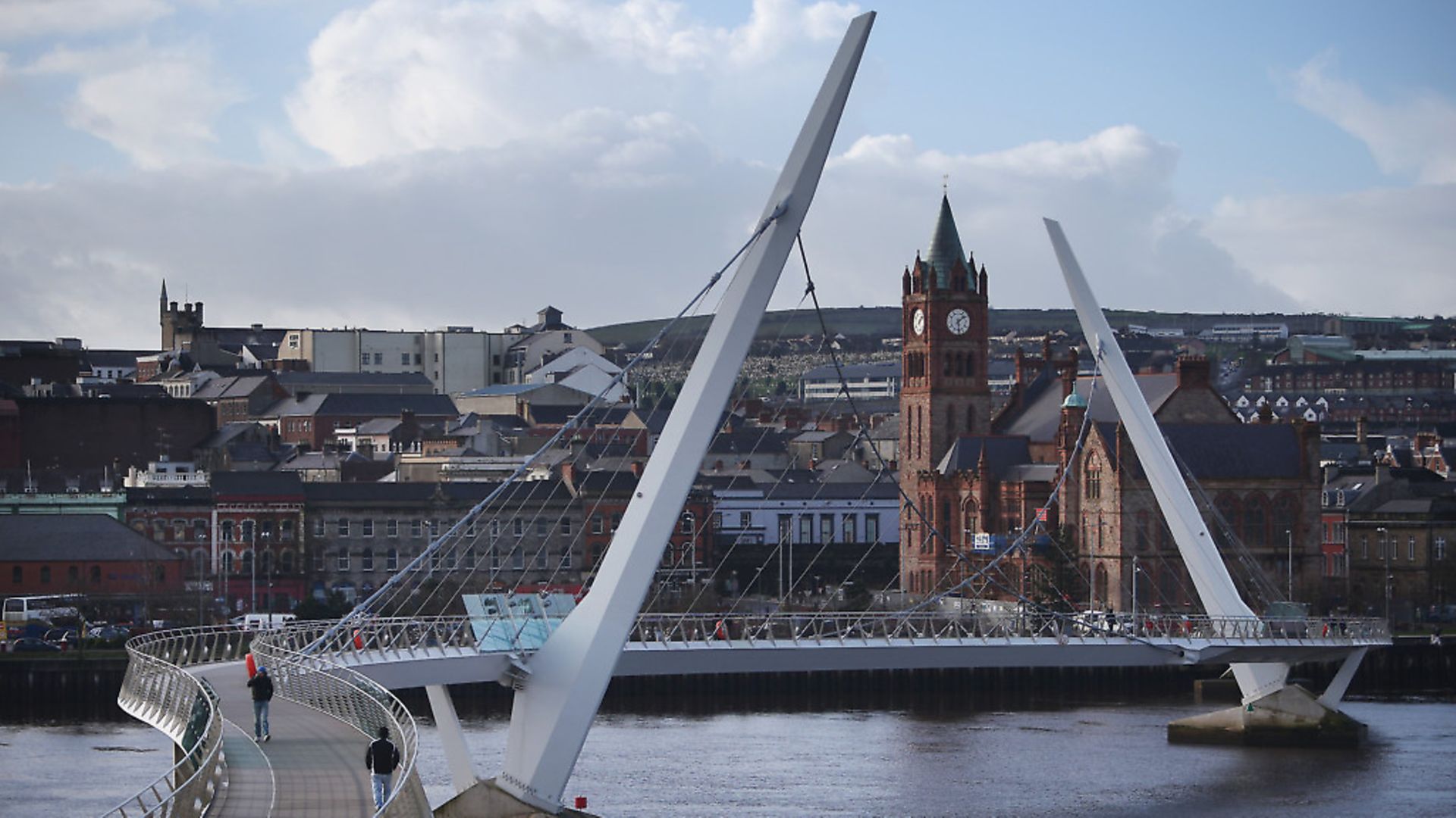 The Peace Bridge crosses the River Foyle in sight of The Guildhall building in Londonderry, Northern Ireland.  (Photo by Peter Macdiarmid/Getty Images) - Credit: Getty Images