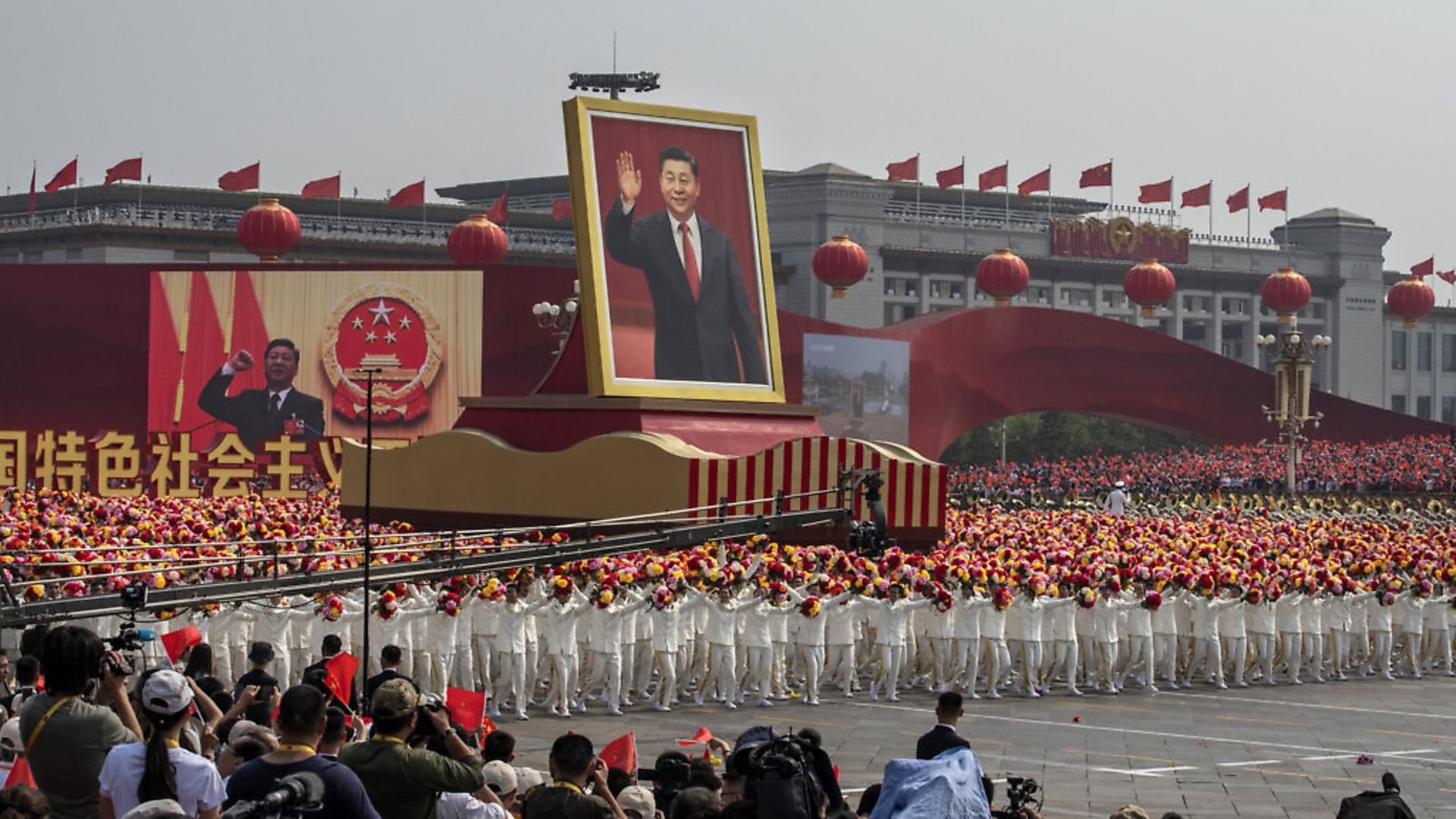 A giant portrait of Chinese President Xi Jinping is carried atop a float at a parade to celebrate the 70th Anniversary of the founding of the People's Republic of China in 1949 in Beijing, China. (Photo by Kevin Frayer/Getty Images) - Credit: Getty Images