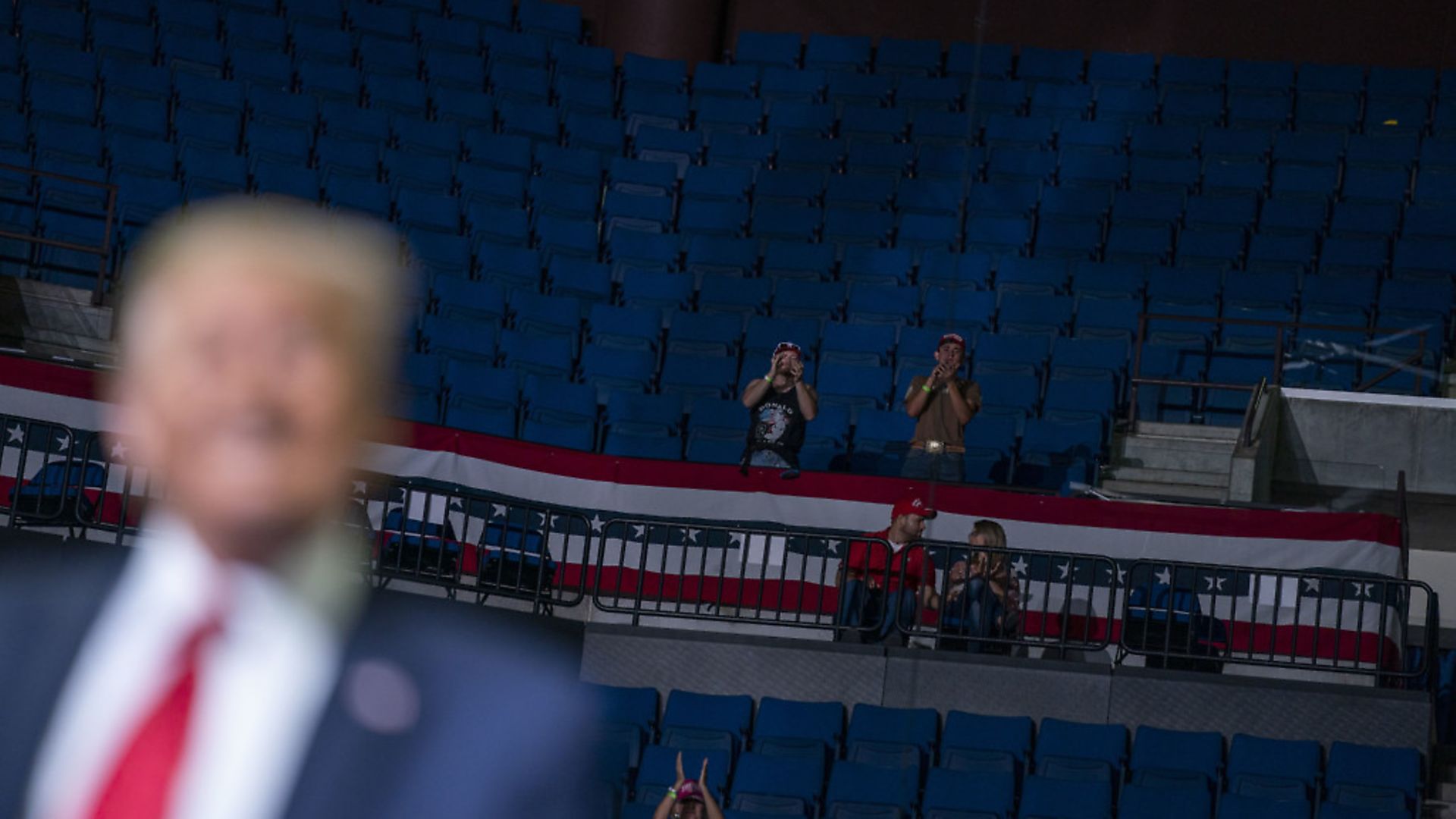 President Donald Trump supporters cheer as Trump speaks during a campaign rally at the BOK Center in Tulsa, Okla. (AP Photo/Evan Vucci) - Credit: AP