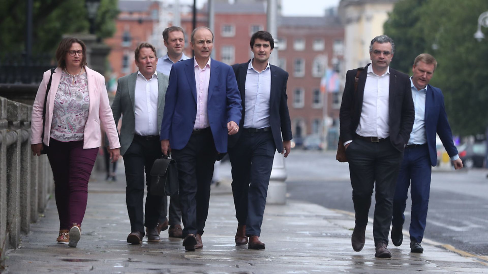 Fianna Fail leader Micheal Martin (centre) arrives at government buildings in Dublin to discuss outstanding issues, as leaders of Fine Gael, Fianna Fail and the Green Party are set to formally agree a draft programme for government between their parties later. Photograph: Niall Carson/PA Wire. - Credit: PA