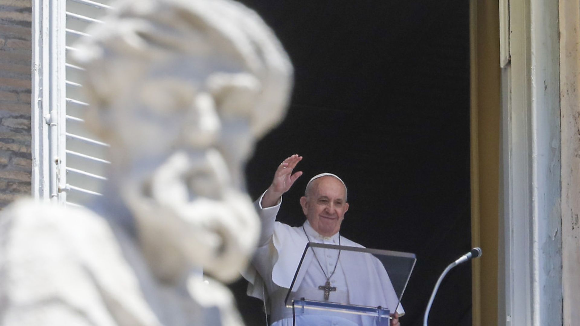 Pope Francis delivers his blessing as he recites the Angelus noon prayer from the window of his studio overlooking St.Peter's Square, at the Vatican. (AP Photo/Andrew Medichini) - Credit: AP