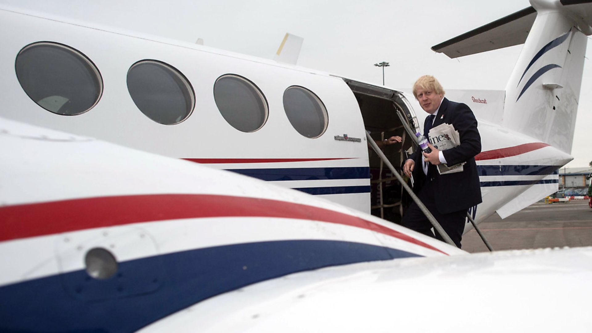 Boris Johnson takes a plane from Southend to East Midlands, which is also red, white and blue. Photograph: Stefan Rousseau/PA. - Credit: PA