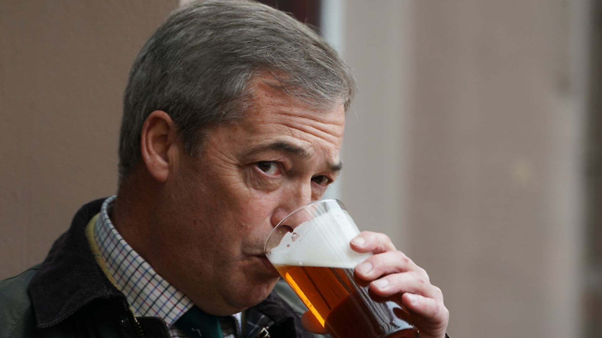 Brexit Party leader Nigel Farage sips a pint in a pub. Photograph: Owen Humphreys/PA. - Credit: PA Wire/PA Images