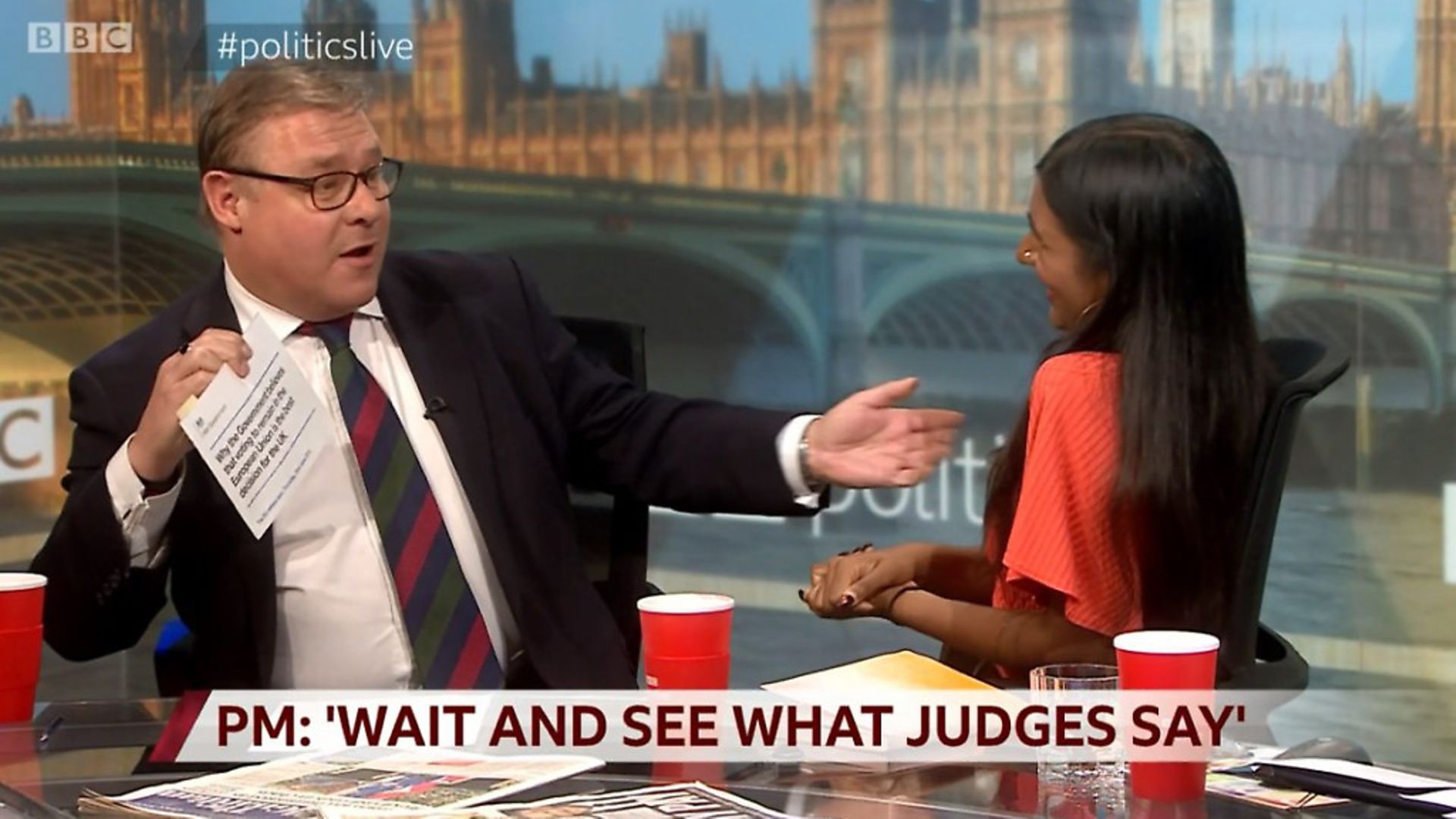 Mark Francois presents the government's EU referendum leaflet to Ash Sarkar on the BBC's Politics Live. Photograph: BBC. - Credit: Archant