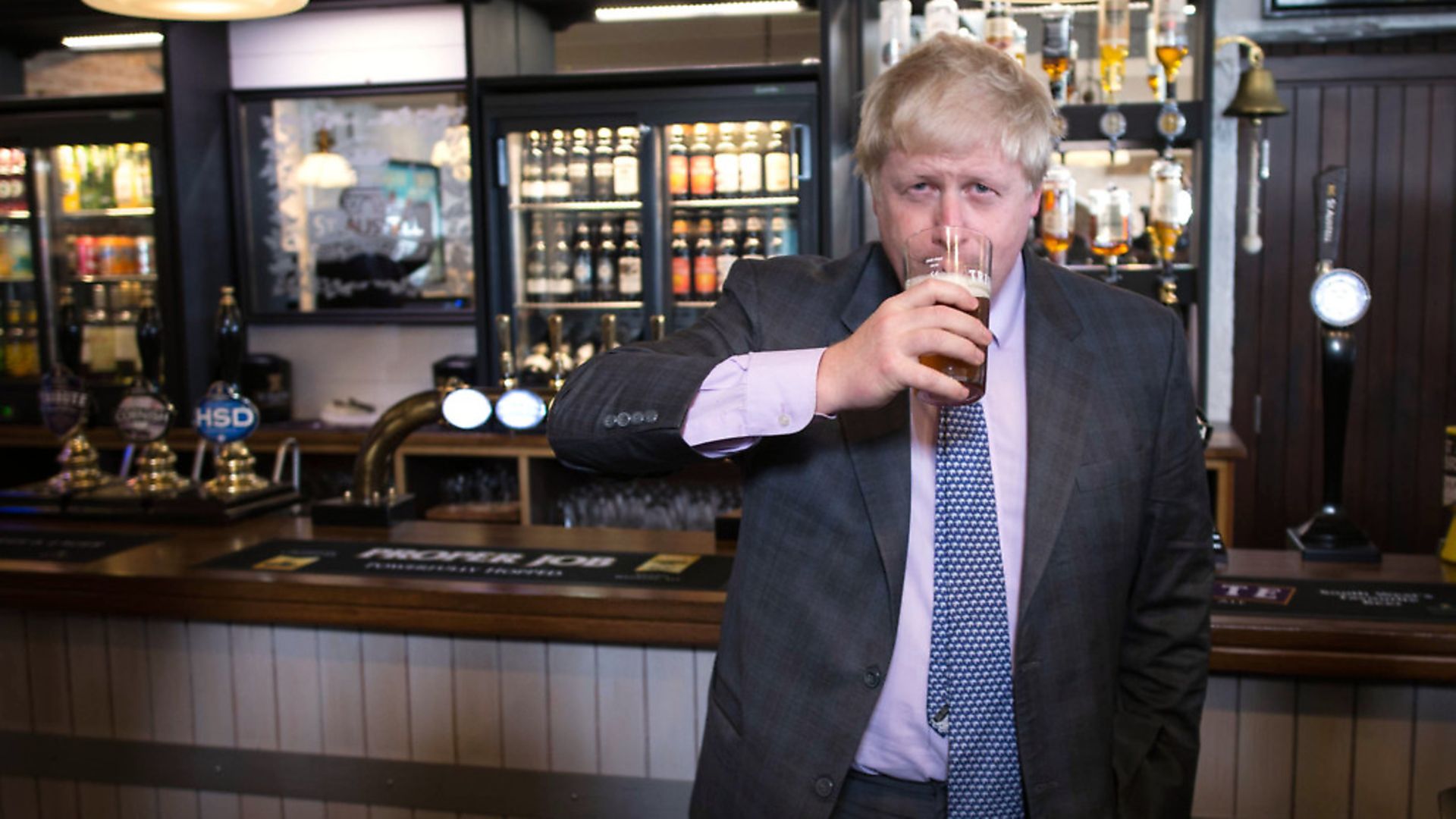 Boris Johnson drinks a pint of beer on a visit to the St Austell Brewery in Cornwall, during a Vote Leave campaign visit. Photograph: Stefan Rousseau/PA. - Credit: PA