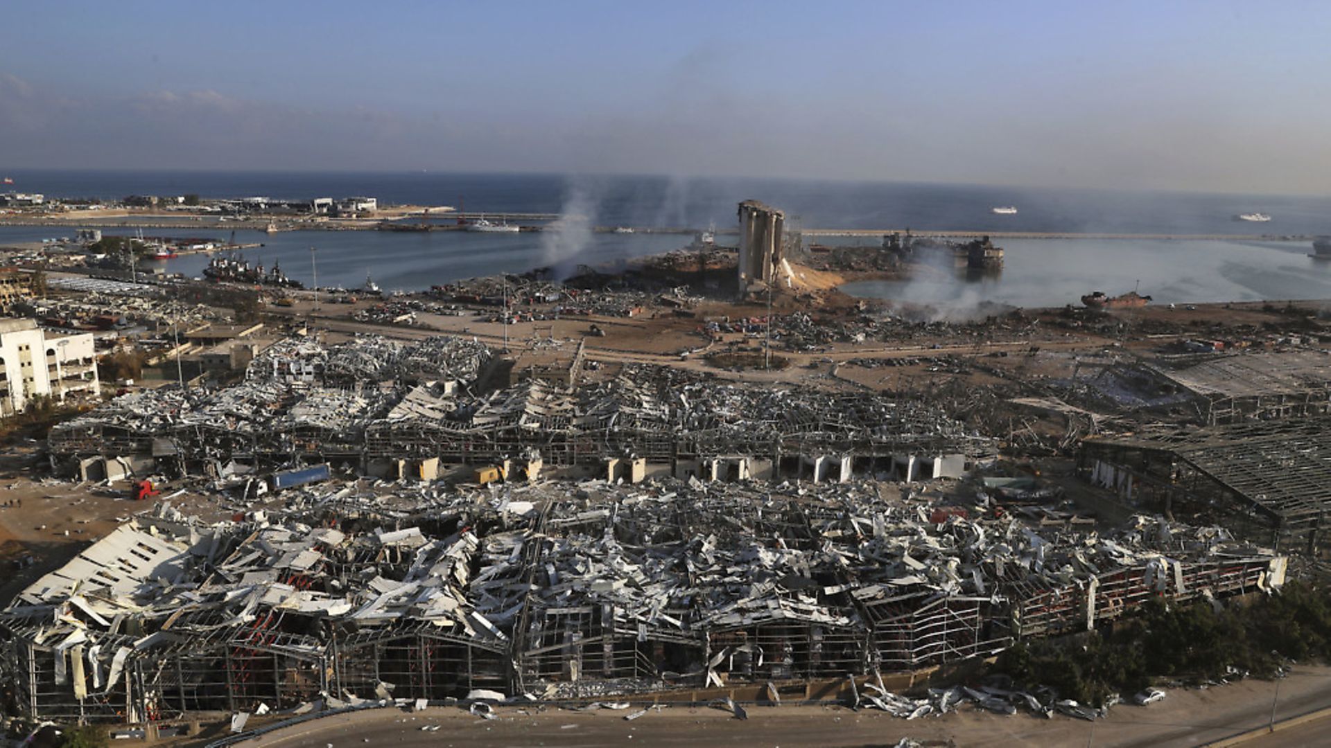 This photo shows a general view of the scene of an explosion that hit the seaport of Beirut, Lebanon. (AP Photo/Bilal Hussein) - Credit: AP