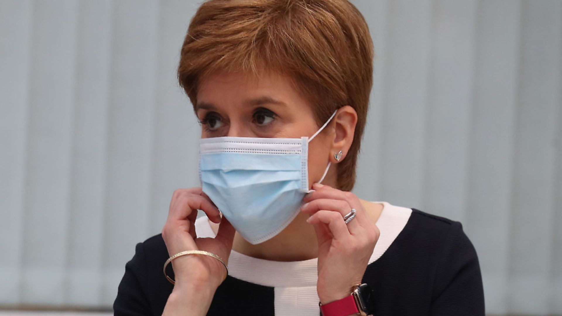 Scotland's First Minister Nicola Sturgeon wears a face mask during her visit to the field hospital the NHS Louisa Jordan(Photo by ANDREW MILLIGAN/POOL/AFP via Getty Images) - Credit: POOL/AFP via Getty Images