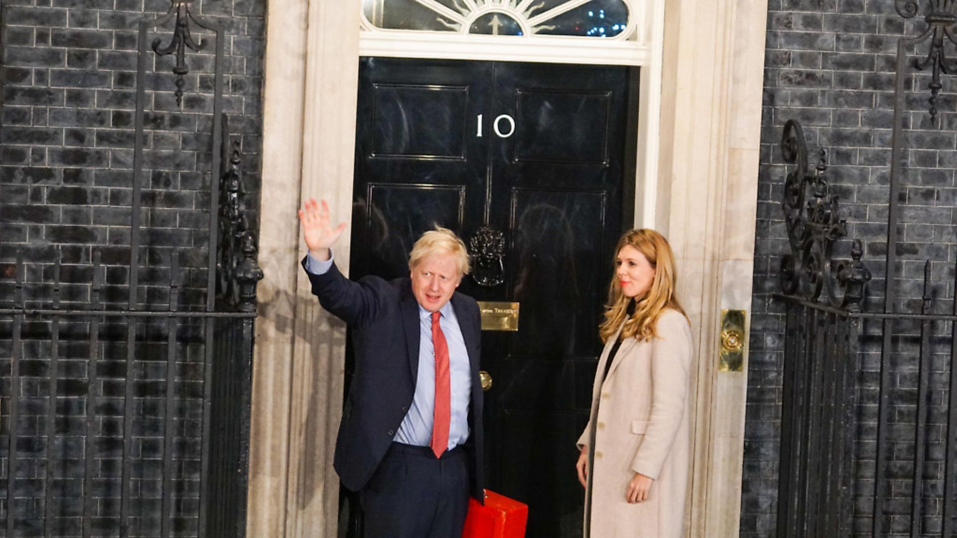 Prime Minister Boris Johnson and his partner Carrie Symonds enter Downing Street. (Photo by Giannis Alexopoulos/NurPhoto via Getty Images) - Credit: NurPhoto via Getty Images