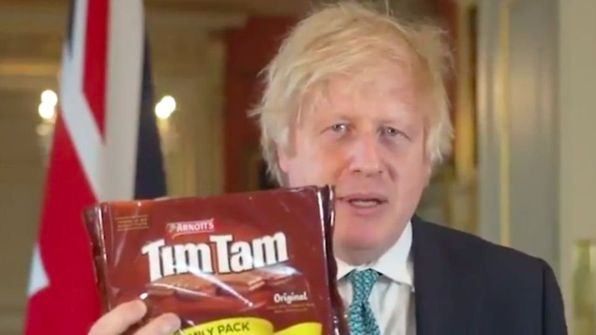 Boris Johnson promotes possible trade deals with New Zealand and Australia using Tim Tams. Photograph: Number 10/Twitter. - Credit: Archant