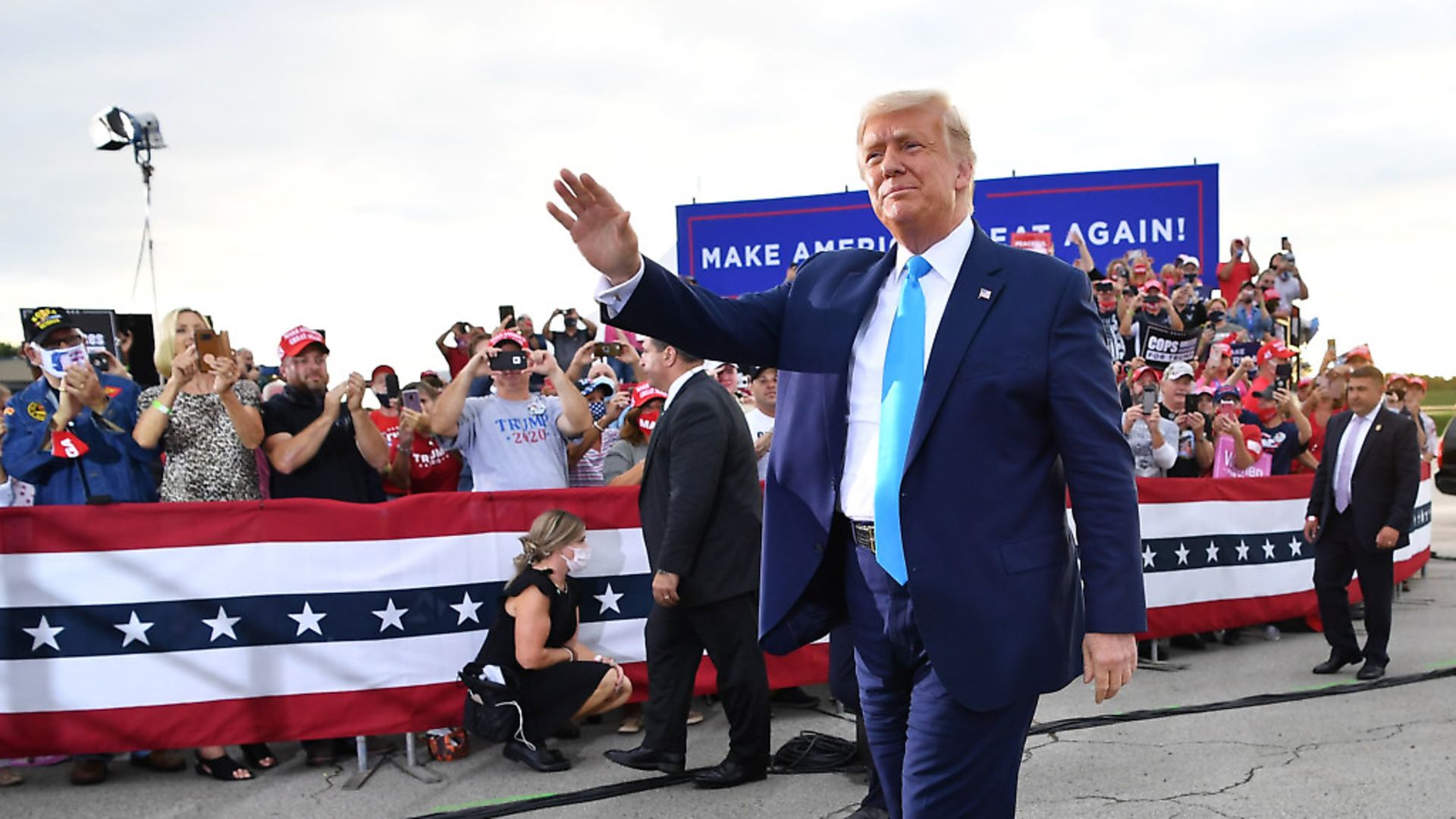 US President Donald Trump waves as he arrives for a campaign event at Arnold Palmer Regional Airport in Latrobe, Pennsylvania. (Photo by MANDEL NGAN/AFP via Getty Images) - Credit: AFP via Getty Images