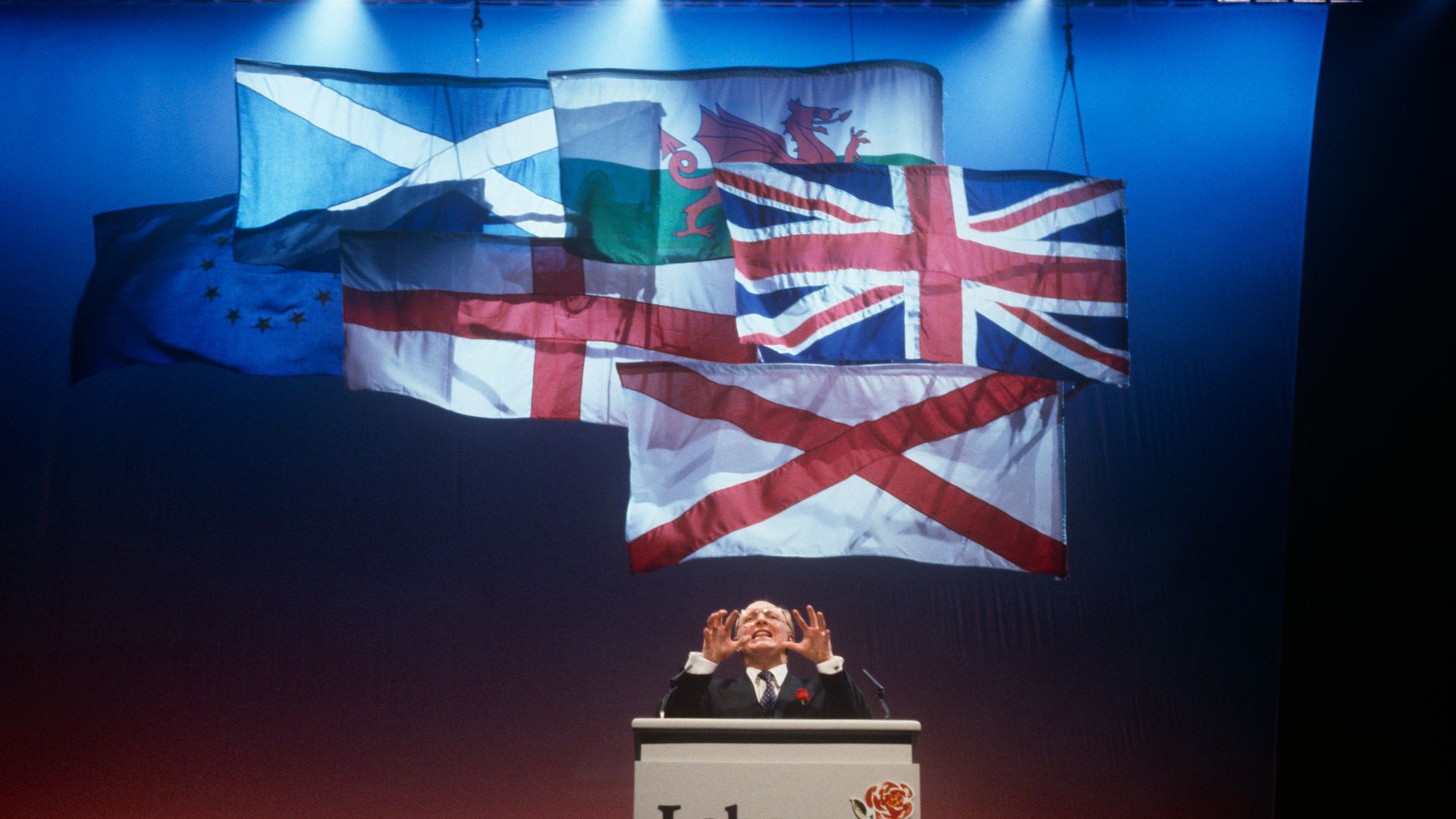 Not alright... Labour leader Neil Kinnock makes his controversial speech at the hubristic Sheffield rally held before the 1992 election, which the party lost. A pumped up Kinnock took to the podium and yelled "Well all right!" four times - Credit: In Pictures via Getty Images