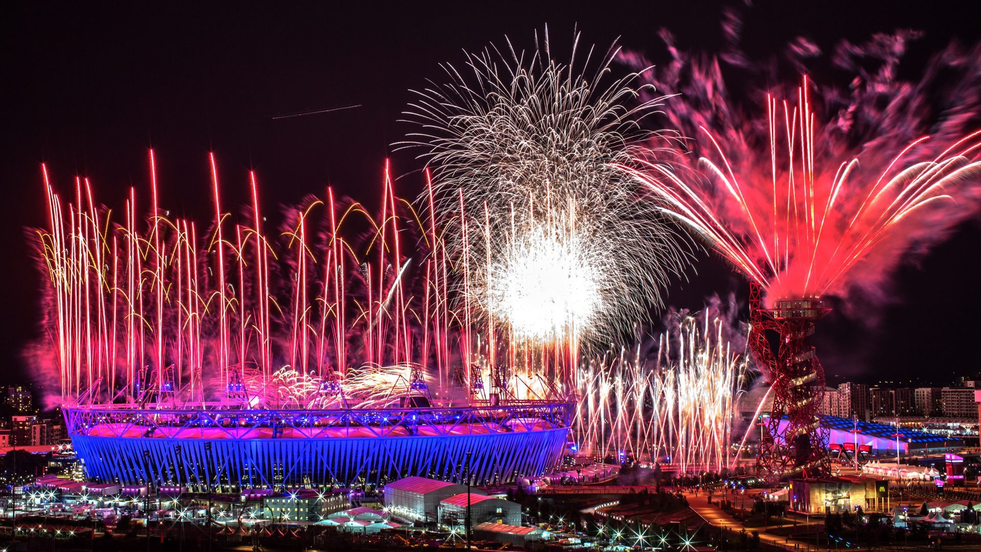 Fireworks explode over the Olympic Stadium during the opening ceremony of the 2012 London Olympic Games (Photo by Daniel Berehulak/Getty Images)