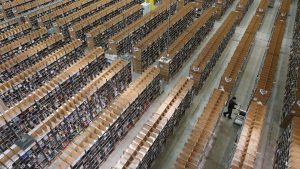 A worker is almost lost among shelves at an Amazon warehouse in Germany, which has a higher productivity rate than the UK. Photo: Sean Gallup/Getty