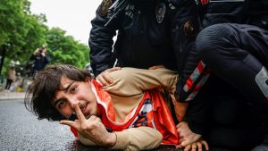 Turkish police detain a protester as he and others attempt to march to Taksim Square on May Day. Photo: Kemal Aslan/AFP/Getty