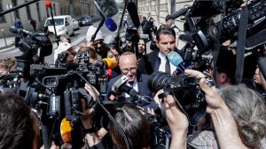 The leader of Les Républicains, Éric Ciotti (centre), addresses the media as he leaves party HQ in Paris on June 13, 2024. Photo: Stephane de Sakutin/AFP/Getty