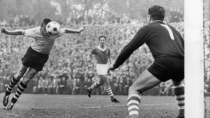 Borussia Dortmund’s ‘Timo’ Konietzka heads a goal past FC Schalke 04 goalkeeper Gyula Tóth during the 1964-1965 Bundesliga season. Photo: Horstmüller/ullstein bild/Getty