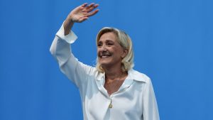 Marine Le Pen greets supporters as she attends a meeting of the Rassemblement National. Photo: Pascal Guyot/AFP/Getty
