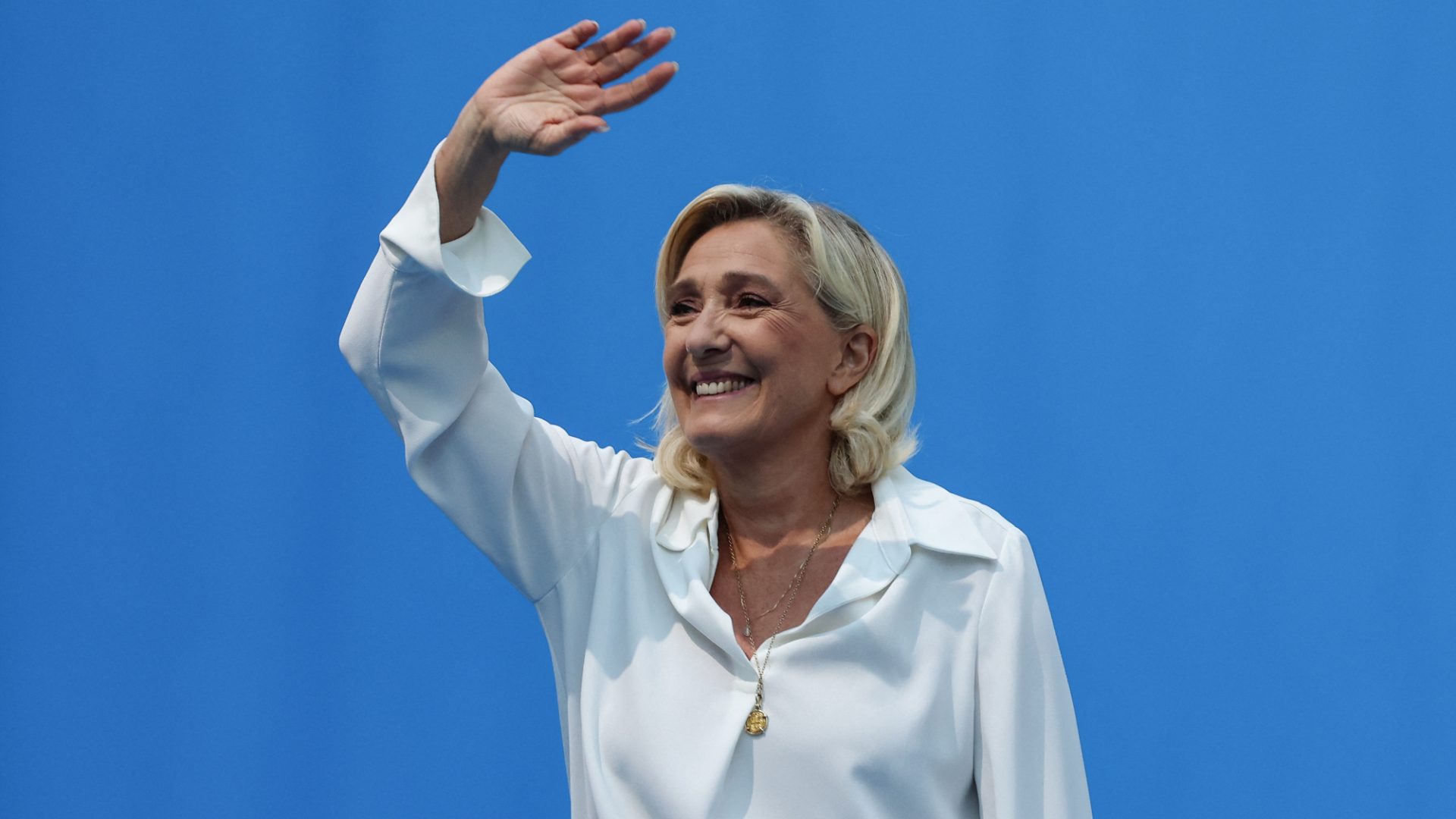Marine Le Pen greets supporters as she attends a meeting of the Rassemblement National. Photo: Pascal Guyot/AFP/Getty