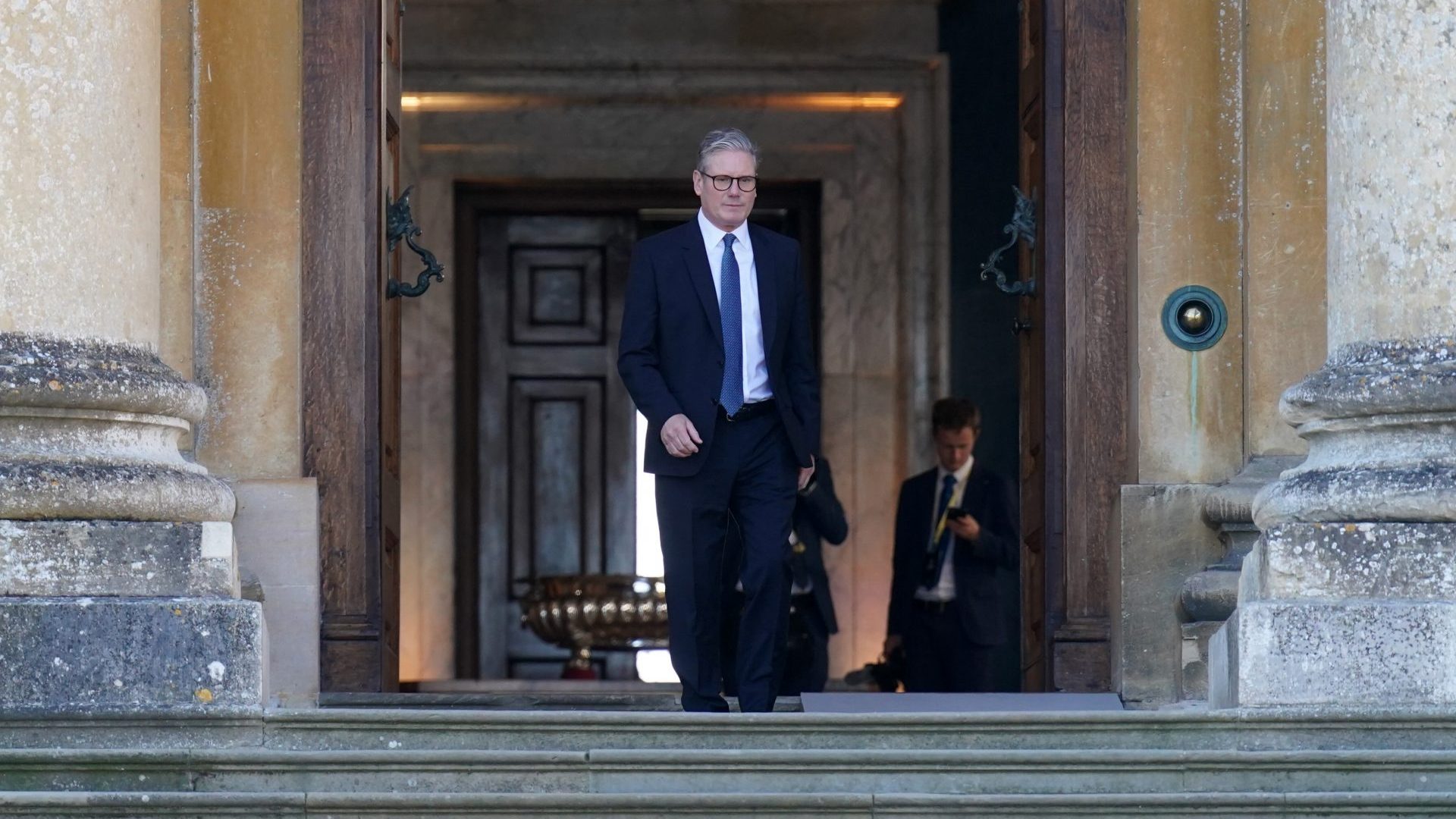 Keir Starmer waits to greet guests ahead of the European Political Community summit at Blenheim Palace. Photo: Stefan Rousseau - WPA Pool/Getty Images