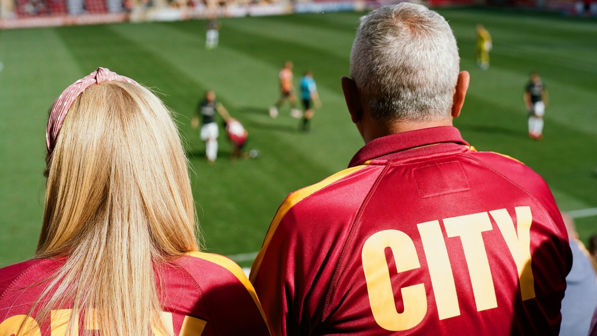A pair of Bradford City fans support their team at Valley Parade in 2019. The club was relegated to League Two at the end of the 2018-19 season. All photos: Stuart Roy Clarke/Homes of Football
