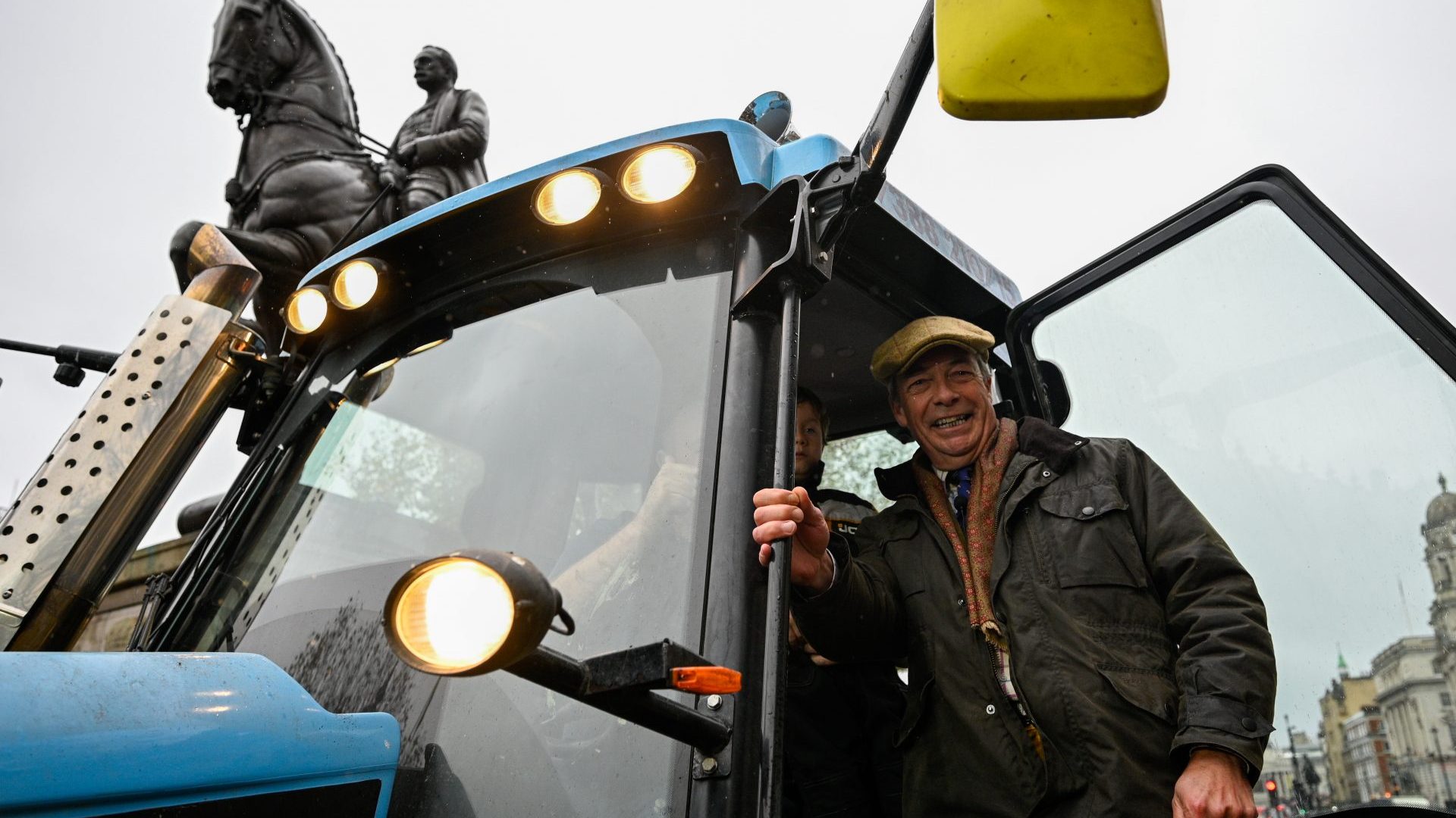 Nigel Farage on the steps of a tractor that made its way onto Whitehall for the farmers' rally (Photo by Ben Montgomery/Getty Images)