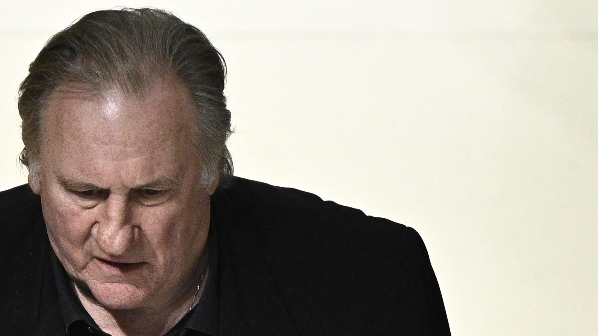 French actor Gerard Depardieu looks on as he returns to the courtroom after a break on the fourth day of his trial. Photo:  JULIEN DE ROSA/AFP via Getty Images