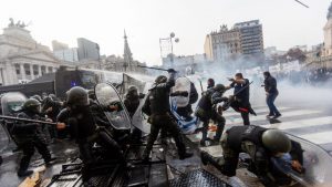 Demonstrators clash with riot police outside the National Congress in Buenos Aires in June last year. Photo: Tomas Cuesta/AFP/Getty
