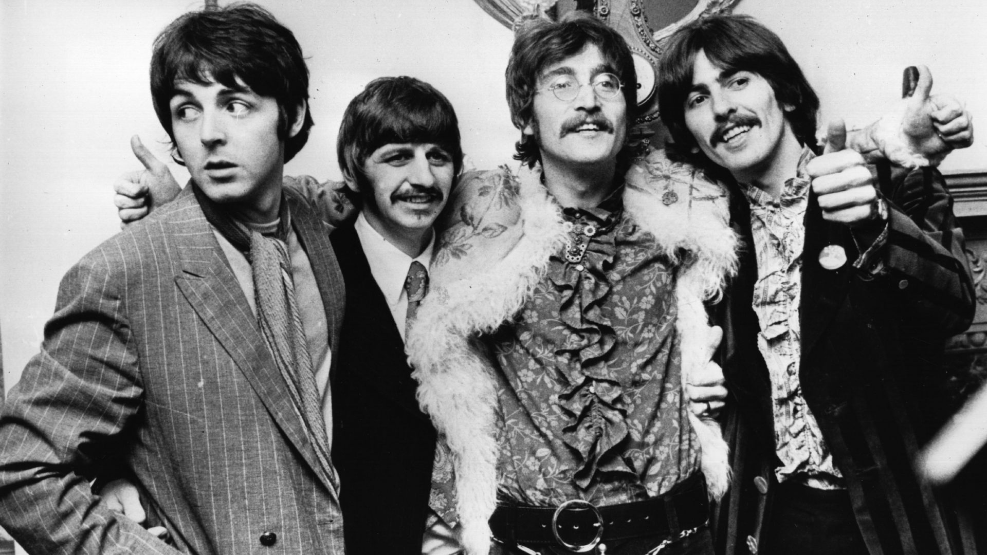 The Beatles celebrate the completion of their album Sgt Pepperʼs Lonely Hearts Club Band at a press conference held at the west London home of their manager Brian Epstein, May 1967. Photo: John Pratt/ Keystone/Getty