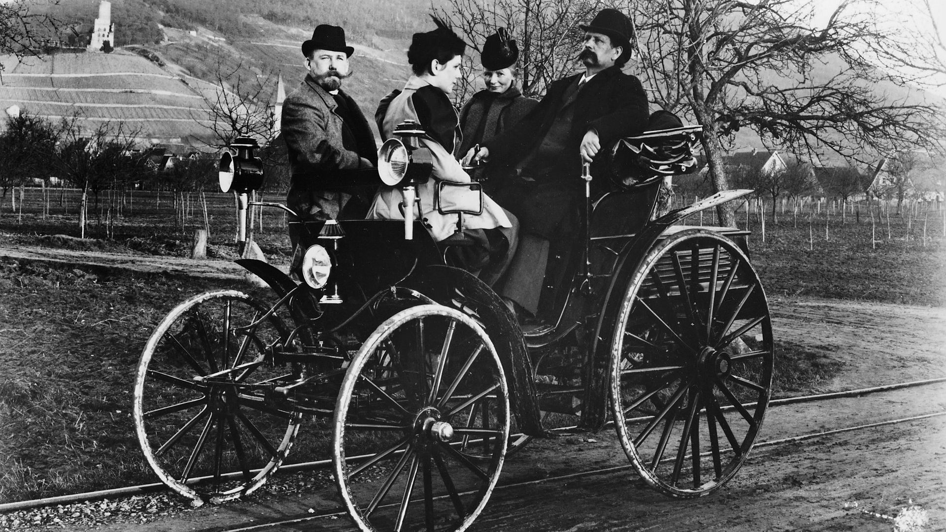 Karl Benz (right) with his wife Bertha in a Benz Viktoria, 1893. His daughter sits opposite him next to a 
colleague, Fritz Held. The Benz Viktoria was the first of his cars to have four wheels. Photo: National  Motor Museum/Heritage Images/Getty