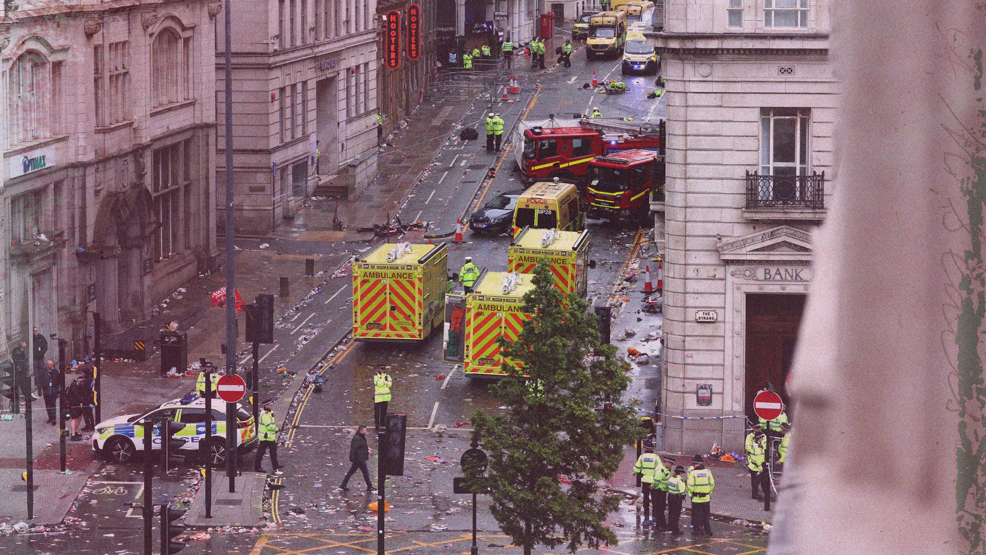 Police officers investigate the scene of an incident in Water Street. Image:  DARREN STAPLES/AFP via Getty Images/TNE