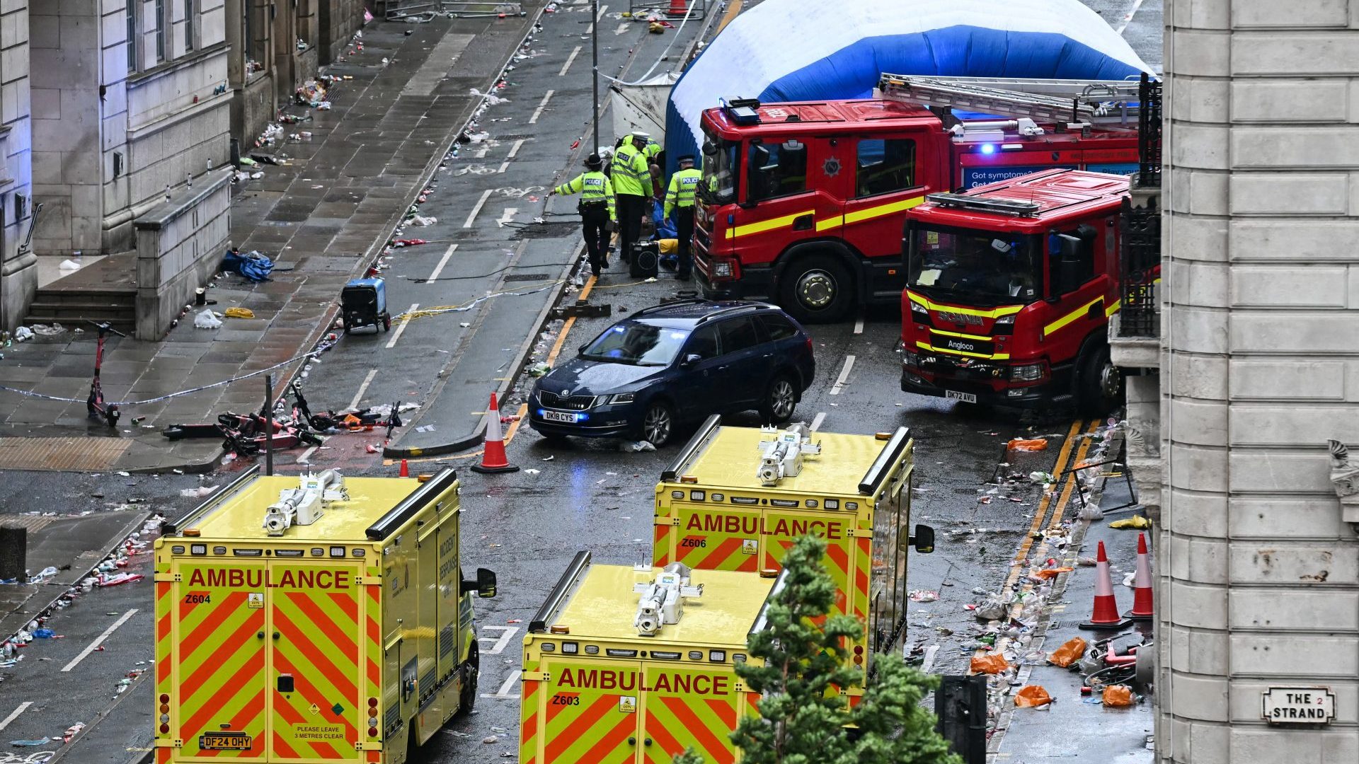 Police officers at the scene of an incident at an open-top bus victory parade for Liverpool's Premier League title win. Photo: PAUL ELLIS/AFP via Getty Images