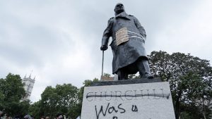 The defaced statue of Winston Churchill in Parliament Square after a protest to show solidarity with the Black Lives Matter movement in June 2020. Photo: ISABEL INFANTES/AFP/Getty
