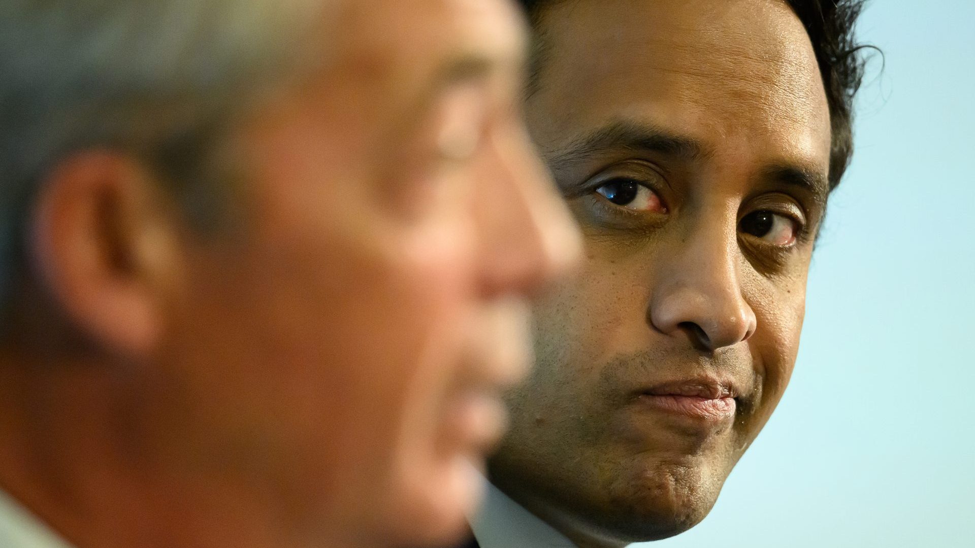 Former Reform chairman Zia Yusuf and leader Nigel Farage attend a Reform UK press conference. Photo: Leon Neal/Getty Images