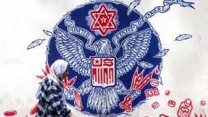 A mural on the wall of the former US embassy in Tehran depicts a parody of the Great Seal of the US, featuring drugs and firearms, and a Star of David. Image: Atta Kenare/AFP/Getty