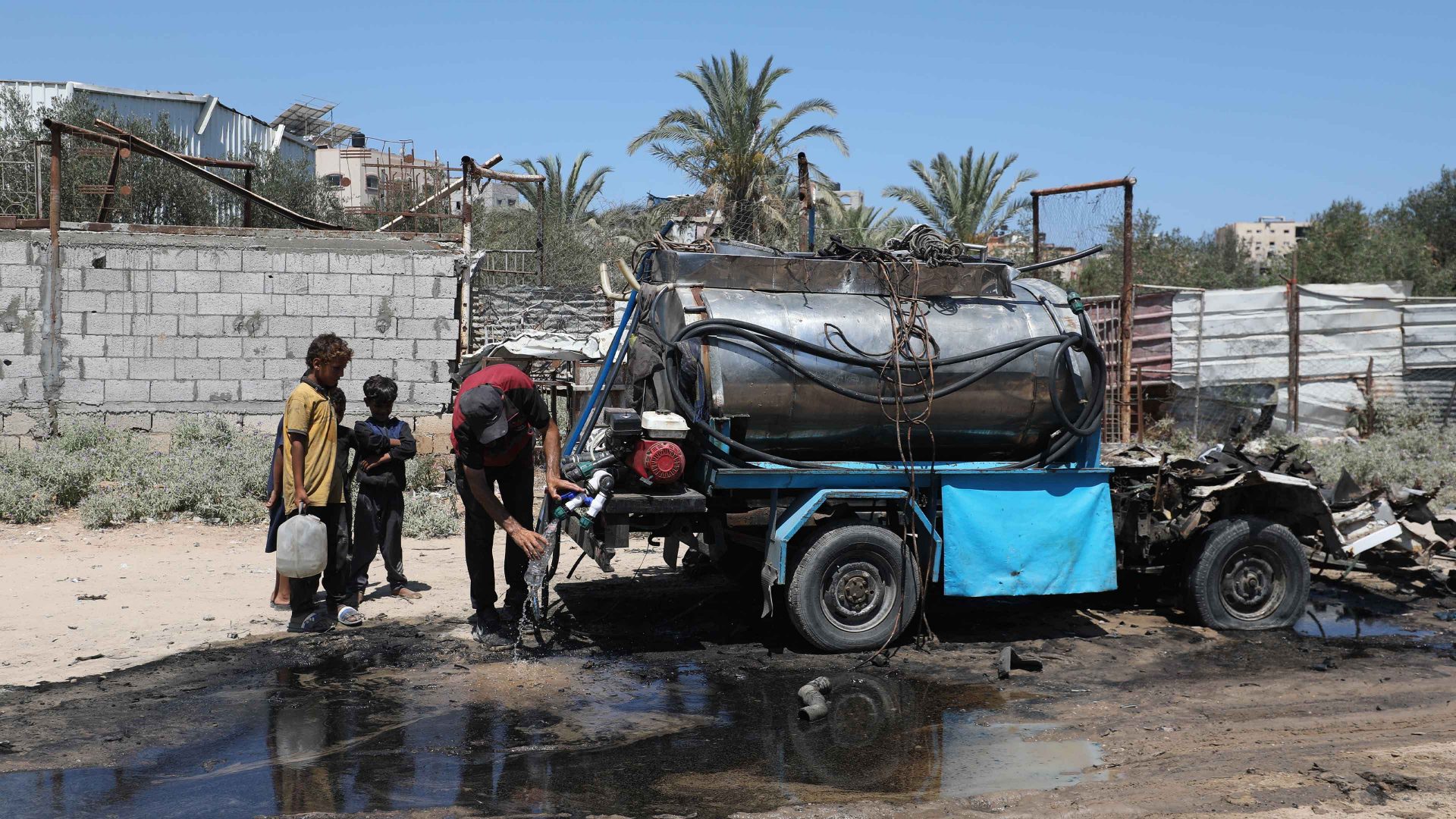 A water tanker left unusable by Israeli strikes on the Nuseirat refugee camp in Gaza. Image: Moiz Salhi/Anadolu/Getty