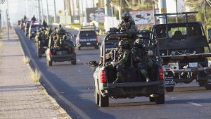 Members of the Mexican army after an operation to arrest the son of former drug lord Joaquin ‘El Chapo’ Guzmán in Culiacán, Sinaloa state, January 2023. Image: Juan Carlos Cruz/AFP/Getty