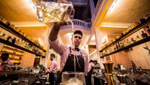 A bartender prepares a cocktail in Alquímico Bar in Cartagena de Indias, a city on Colombia’s Caribbean coast. Image: Harriet Barber