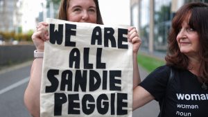 Supporters of Sandie Peggie stand outside as the tribunal resumes on July 16 in Dundee. IMAGE: JEFF J MITCHELL/GETTY
