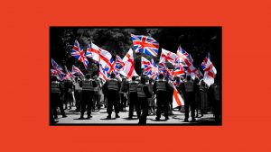 Anti illegal immigration protesters wave Union flags (Union Jacks) as police hold the line outside The Roundhouse hotel. Image: innbarr Webster/Getty Images/TNW