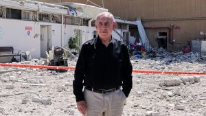 Benjamin Netanyahu stands amid debris outside the Soroka Hospital in the southern Israel city of Beersheba. Image: Marc Israel Sellem/ Pool/AFP/Getty 