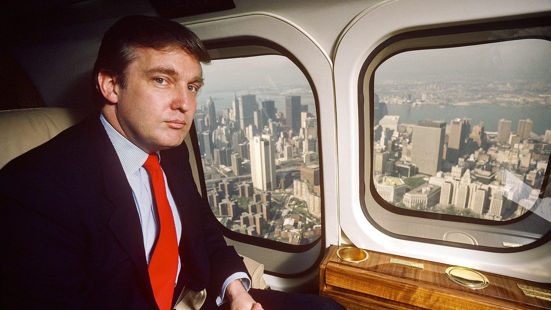 Real estate developer Donald J Trump flies from New York City to Atlantic City in his Puma helicopter, 1987. Image: Joe McNally/Getty